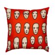 Faces on Red Cushion